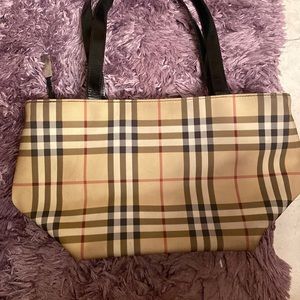 Authentic signature Burberry Purse with black leather handles.